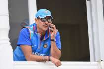 Ravi Shastri of India speaks on the phone during net