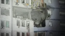 A residential building is seen damaged after a Russian