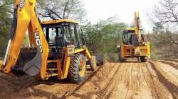 Farmers filling SYL canal with the help of tracked excavators on Wednesday