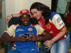 Gayle with wife Natasha