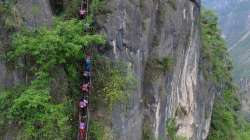 Children climb 2,500 foot ladder to go to school