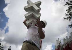 Greg Zanis carrying the crosses for the memorial