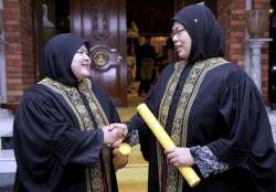 Nenney Shuhaidah Shamsuddin  Noor Huda Roslan after receiving their appointment