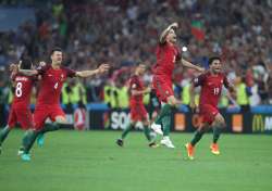 Portugal's players celebrate win against Poland in Euro 2016 quarterfinal