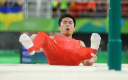 Chinese gymnast You Hao after falling during the men’s parallel bars final 
