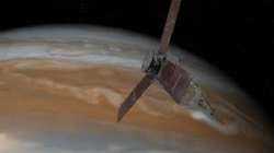 This illustration depicts NASA's Juno spacecraft approaching Jupiter.