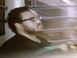 Rurik Jutting, a British banker, sitting in a prison bus