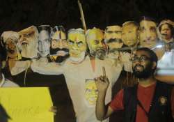 NSUI activist Sunny Diman near effigy of PM Modi and others as Raavan