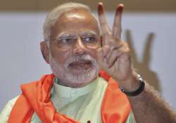 File pic - PM Narendra Modi flashes victory sign