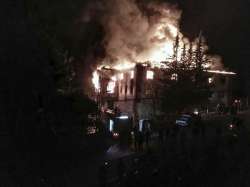 Flames rise from a fire in a school dormitory, in Aladag, Adana in southern Turk