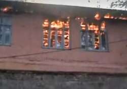 File pic - A school building set ablaze in Kashmir