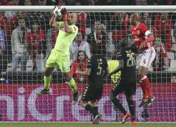 Former Liverpool goalkeeper Pepe Reina in action, holding the ball during a football match