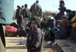 Child at a camp after being evacuated from Aleppo city of Syria