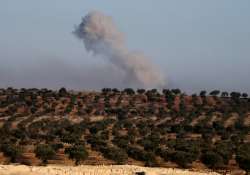 Smokes rise in a east Aleppo neighborhood during a battle 