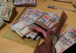 File pic - A bank official counts scrapped Rs 1000 notes 