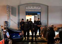 Policemen secure the area in front of the Islamic centre after a shooting 