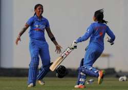 Harmanpreet Kaur and Rajeshwari Gayakwad celebrate after defeating South Africa