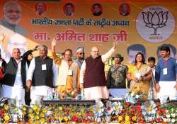 File pic - Amit Shah waves at crowd at a public meeting at Baraut, Bagpat