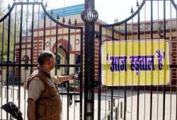 Security guard outside a closed bank in Allahabad