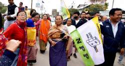 Supporters of NPP celebrate after their candidate's win in Imphal