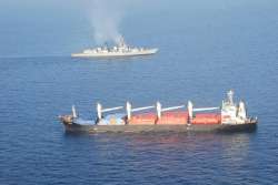 INS Mumbai with the MV OS 35 that was attacked by pirates