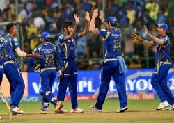 MI players celebrate during an IPL match in Bangalore 