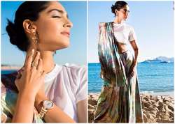 Cannes 2017: Sonam Kapoor weaves the magic on red carpet in an iridescent sari. 