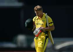 Australian opener David Warner walks off the field after being dismissed.