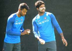 Hardik Pandya and Umesh Yadav bowl in the nets during a practice session