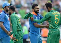 Virat Kohli and Mohammed Amir shake hands after the match.