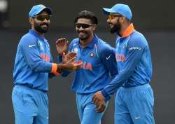 Dinesh Karthik, Ravindra Jadeja and Virat Kohli in action.