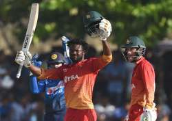 Solomon Mire celebrates after his century.