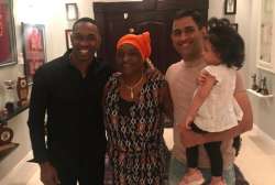 Dwayne Bravo with former Indian skipper MS Dhoni