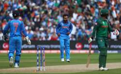 Tamim Iqbal of Bangladesh walks as he is bowled off the bowling of Kedar Jadhav