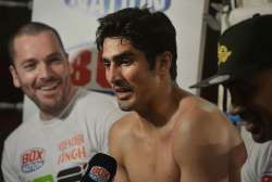 Vijender Singh speaks during a media conference