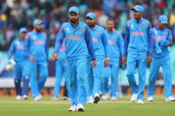 Virat Kohli of India leads the team off the field