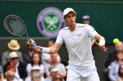 Andy Murray of Great Britain plays a forehand during the first round