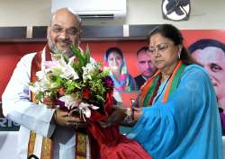 Amit Shah being felicitated by CM Raje during a party programme in Jaipur