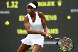 Venus Williams of the United States plays a backhand during the match