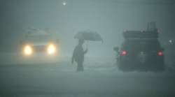 A man walks in heavy rain in Houston, Texas on Aug 27 