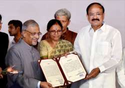 Shumsher Sheriff presents victory certificate to Venkaiah Naidu