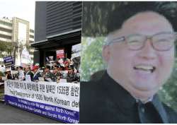 SKorean conservative activists and NKorean defectors at a rally in Seoul