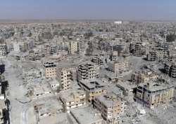 This Thursday, Oct. 19, 2017 frame grab made from drone video shows damaged buildings in Raqqa