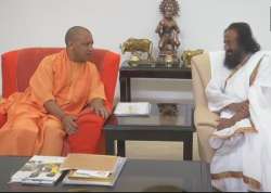 Uttar Pradesh Chief Minister Yogi Adityanath with Sri Sri Ravi Shankar