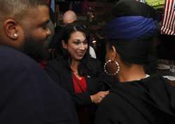 Kelly Convirs-Fowler greets her supporters as results come in Tuesday in Virginia Beach