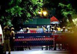 Security persons at out side Jayalalithaa's residence at Poes Garden where I-T Department raids on Friday 