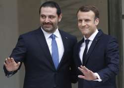 Emmanuel Macron with Lebanon’s PM Saad Hariri at the Elysee Palace in Paris