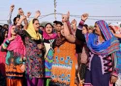  Family members shout slogans against Delhi's Max Hospital after it declared an alive newborn dead.