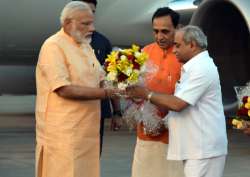 File pic - PM Modi being welcomed in Surat by Gujarat CM Vijay Rupani and Deputy CM Nitin Patel