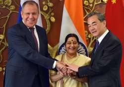 Sushma Swaraj with her Chinese counterpart Wang Yi and Russian Foreign Minister Sergey Lavrov at Jawahar Lal Nehru Bhawan in New Delhi